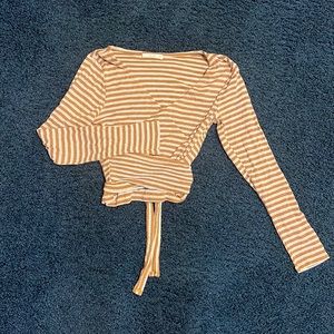 this brown and white striped top from le lis is a size medium